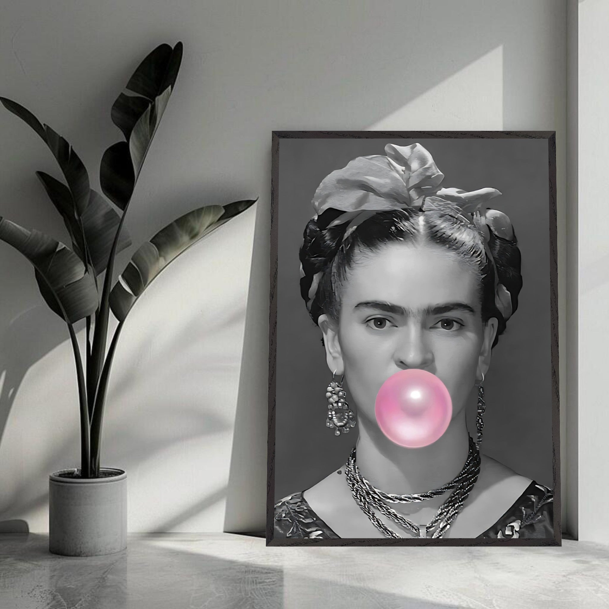 Frida Kahlo framed art blowing bubble gum, black-and-white photography with a playful pink bubble, modern decor.