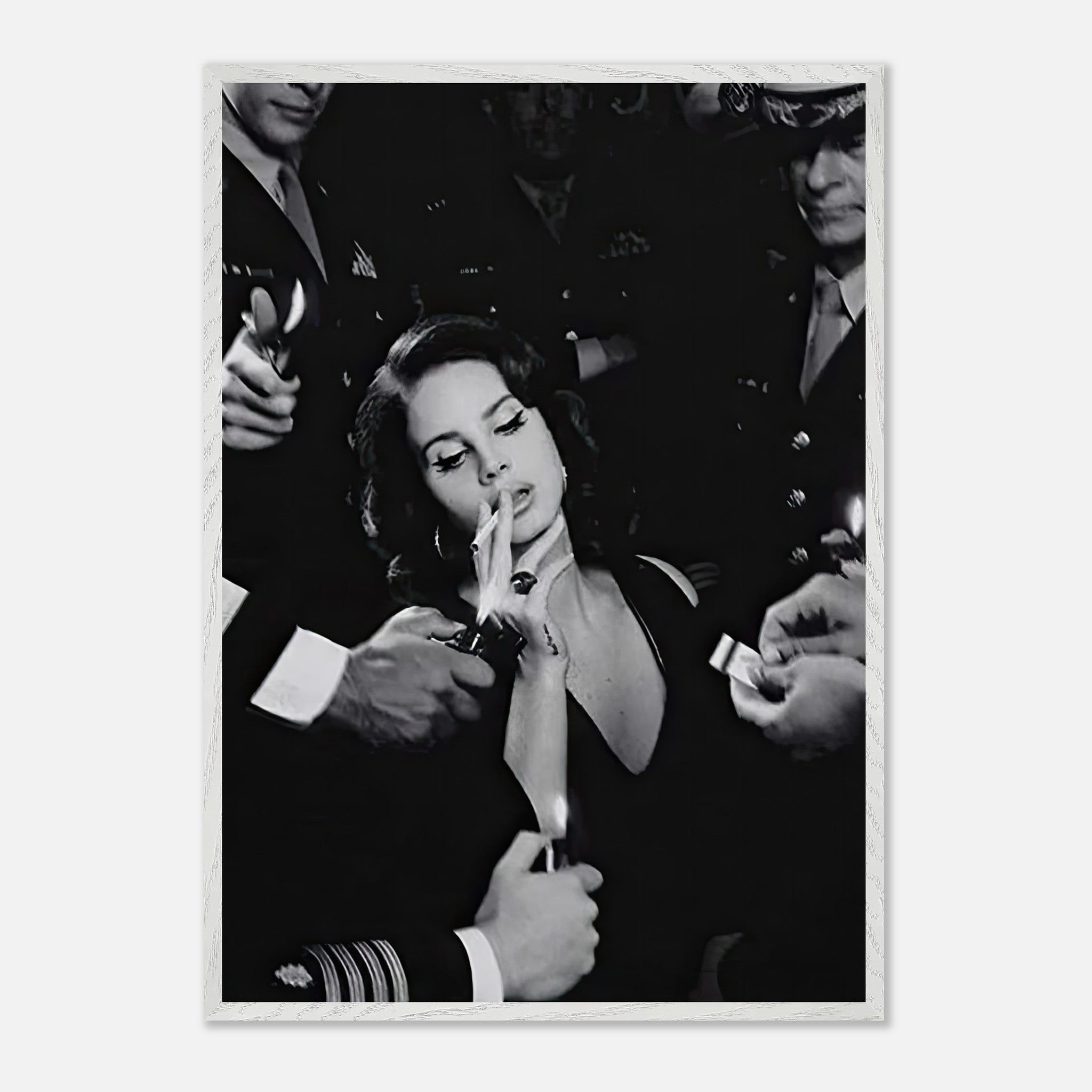 Vintage black-and-white photograph of a woman smoking, surrounded by people holding lighters, exuding timeless elegance.