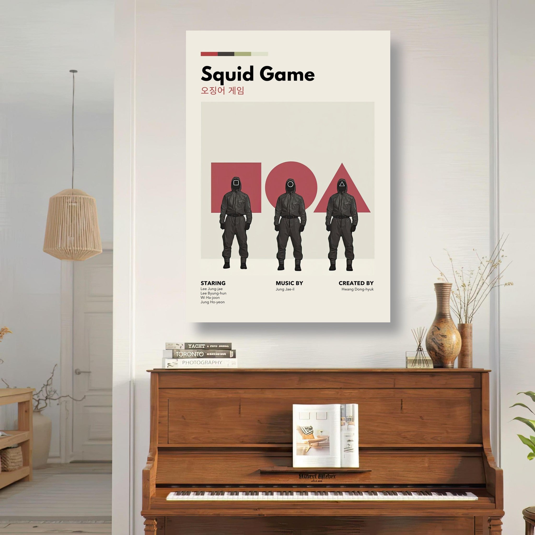 Squid Game vintage metal poster displayed on a wall above a wooden piano, featuring iconic characters and minimalist design.