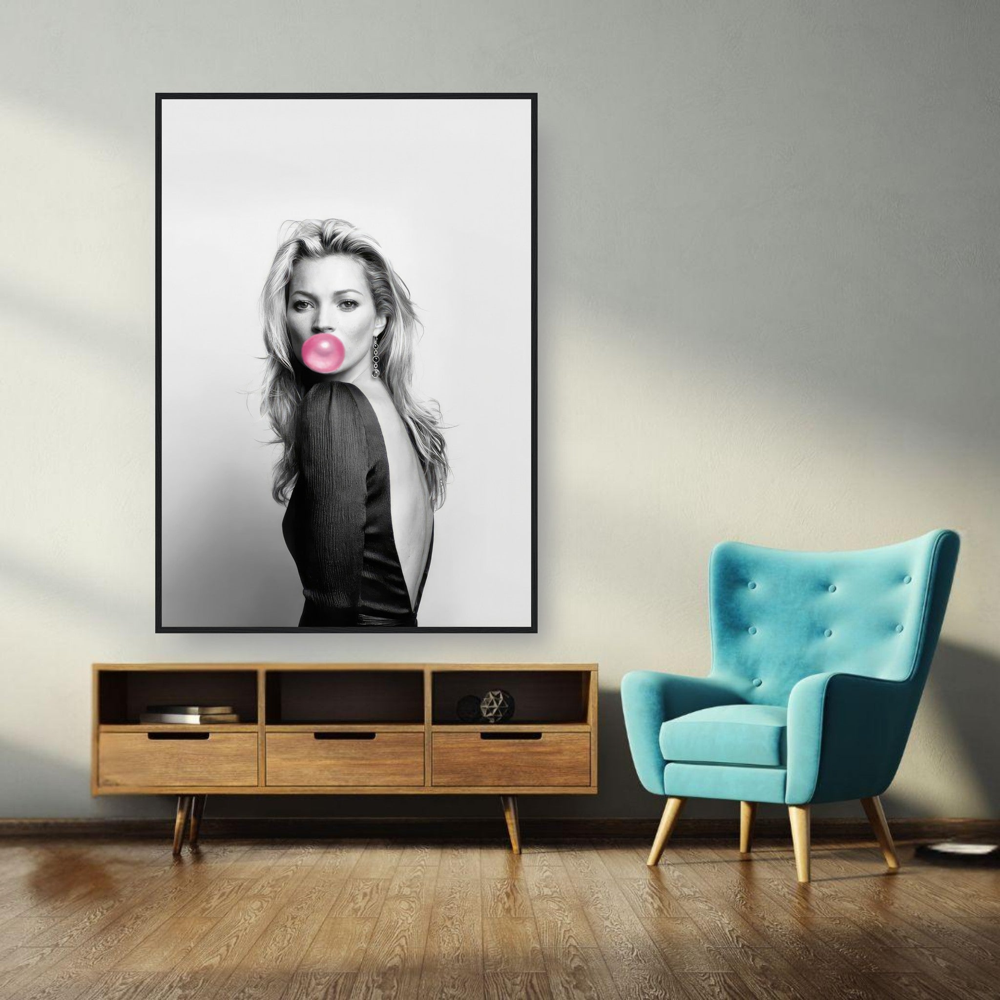 Kate Moss Bubble Gum framed print in stylish modern living room decor with teal chair and wooden furniture.