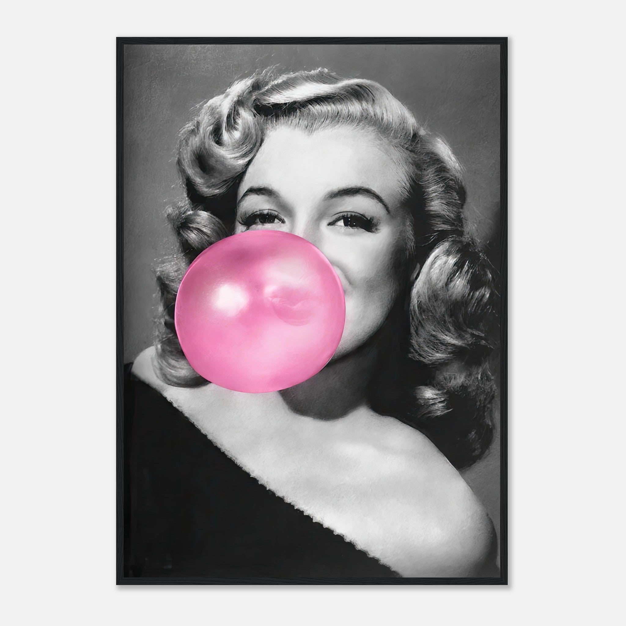 Marilyn Monroe blowing a large pink bubble gum in a chic framed print, combining elegance and playful charm.