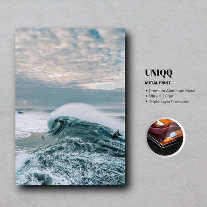 Stunning Big Wave Surfing metal print showcasing a surfer riding a massive wave in vibrant blues and dramatic skies.