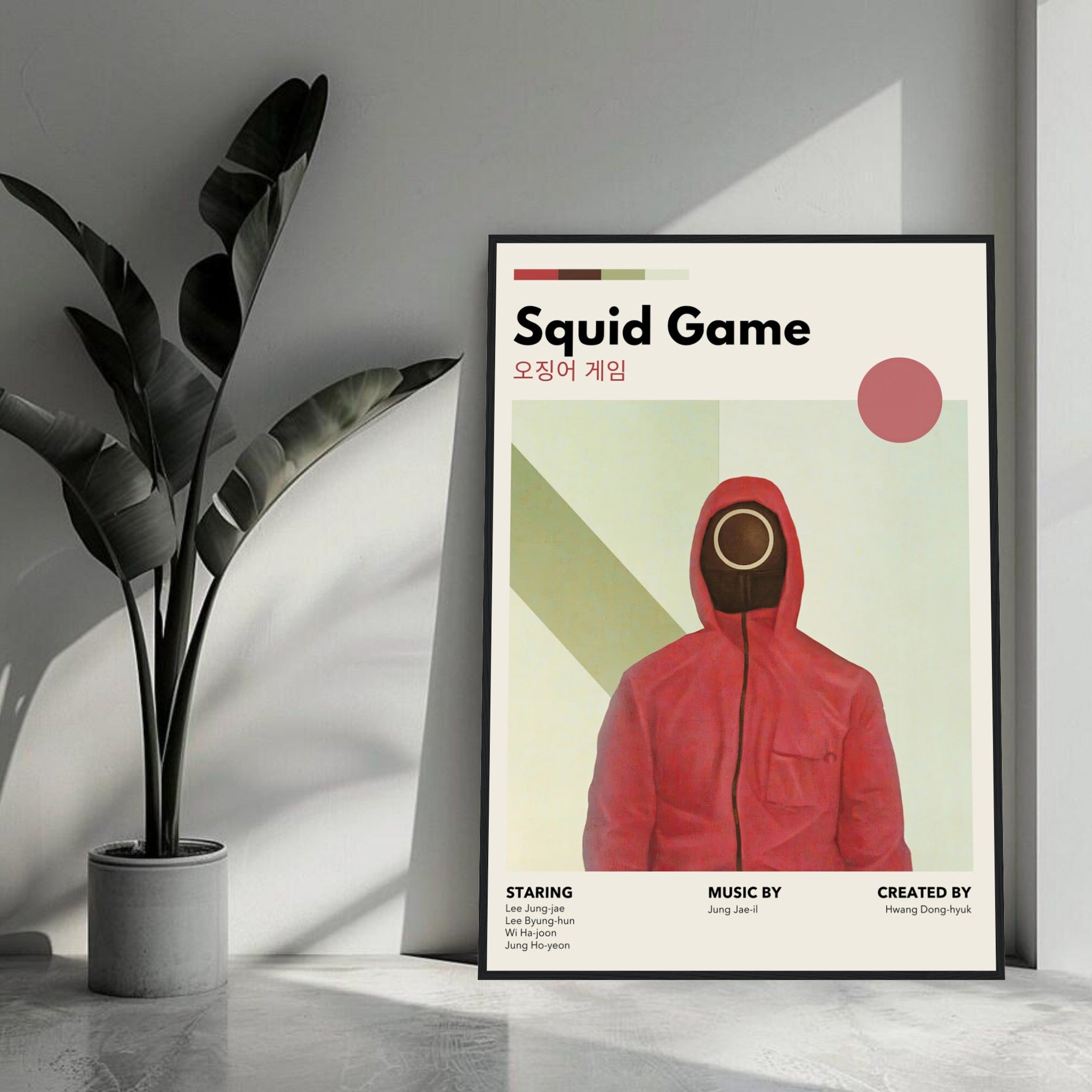 Vintage Squid Game framed print featuring a red-hooded figure and minimalist design in a stylish interior setting.