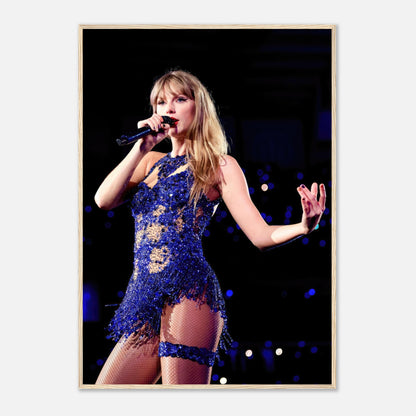 Taylor Swift performing live in a sparkling blue outfit, captured in a stunning framed print for fans and music lovers.