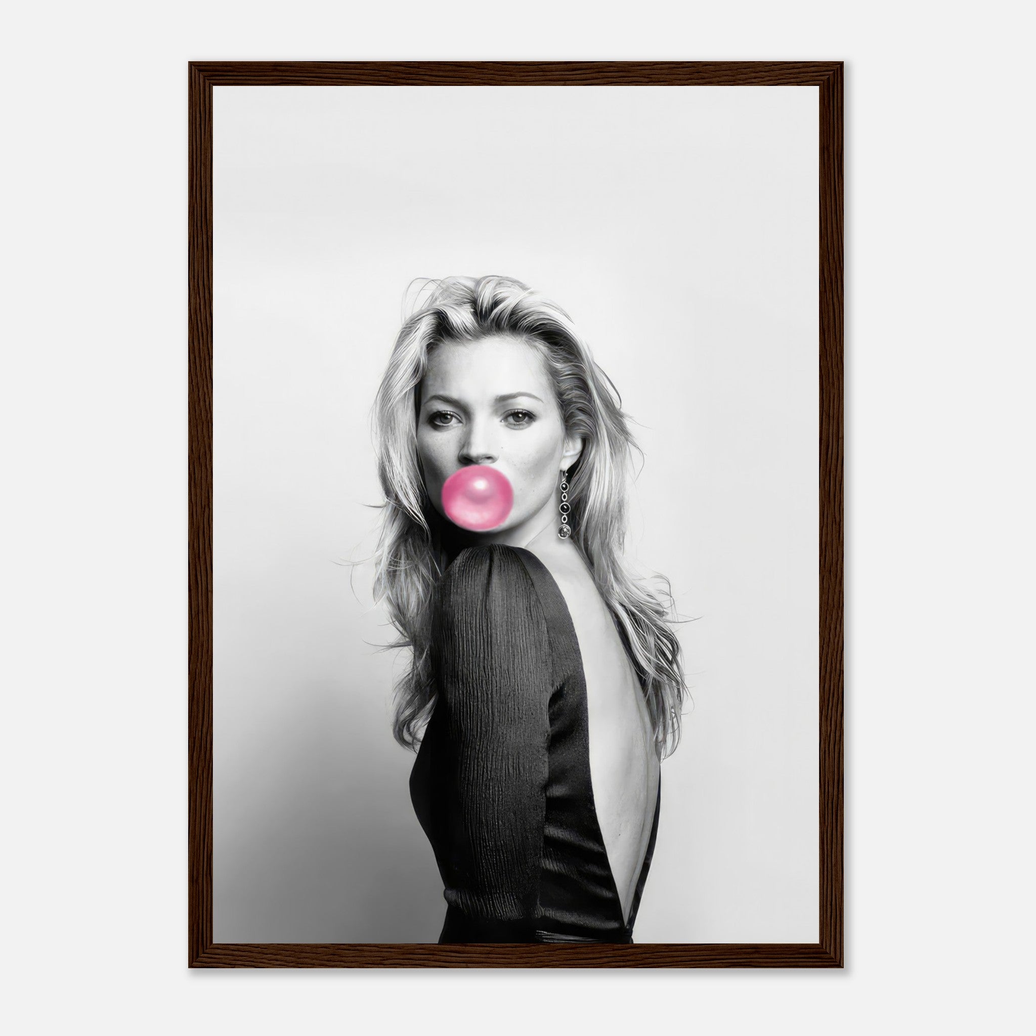 Kate Moss framed print in black-and-white with pink bubble gum accent, adding modern sophistication to decor.