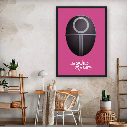 Framed print of Squid Game guard mask on pink background, perfect wall art for fans of the Netflix series.