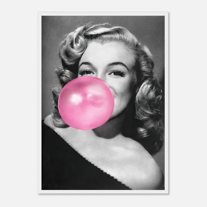 Marilyn Monroe framed print featuring her blowing pink bubble gum, showcasing a blend of sass and glamour for wall décor.