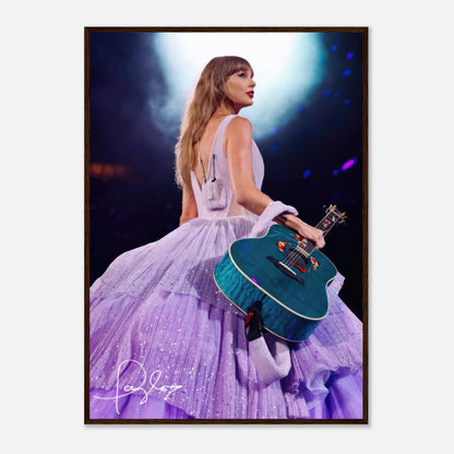 Taylor Swift framed poster in lavender gown holding a guitar, capturing her iconic stage presence and elegance.