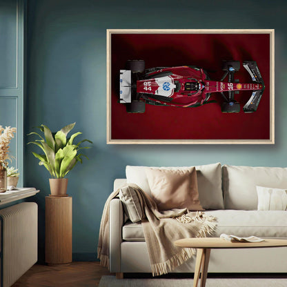 Ferrari F1 2025 framed canvas print showcasing top view of sleek red racing car on deep red background.