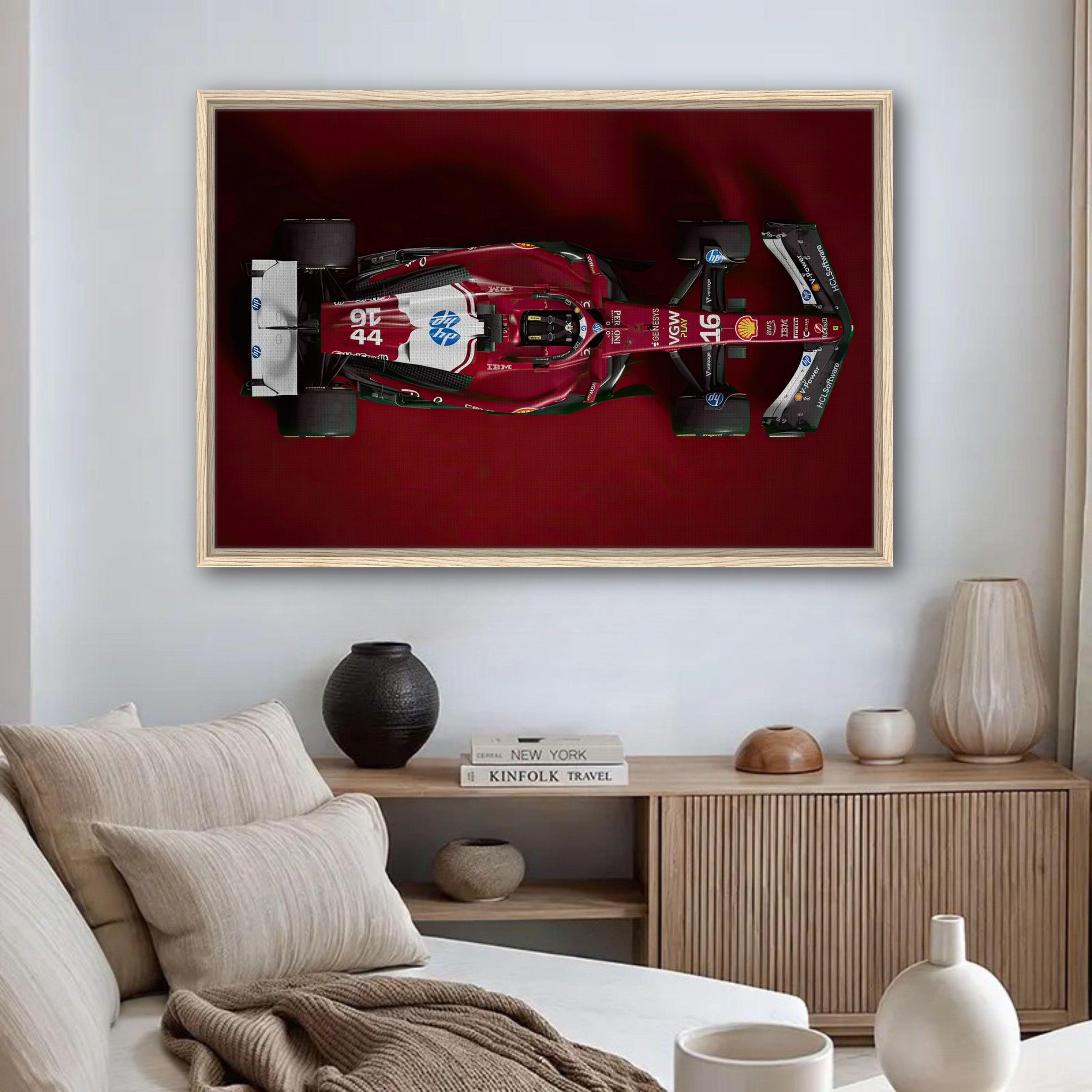 Ferrari F1 2025 framed canvas print showcasing top-down view of race car with deep red background in a modern setting.