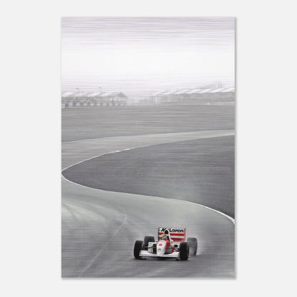 Ayrton Senna driving a McLaren on the track, featured in brushed metal artwork, capturing speed and precision.