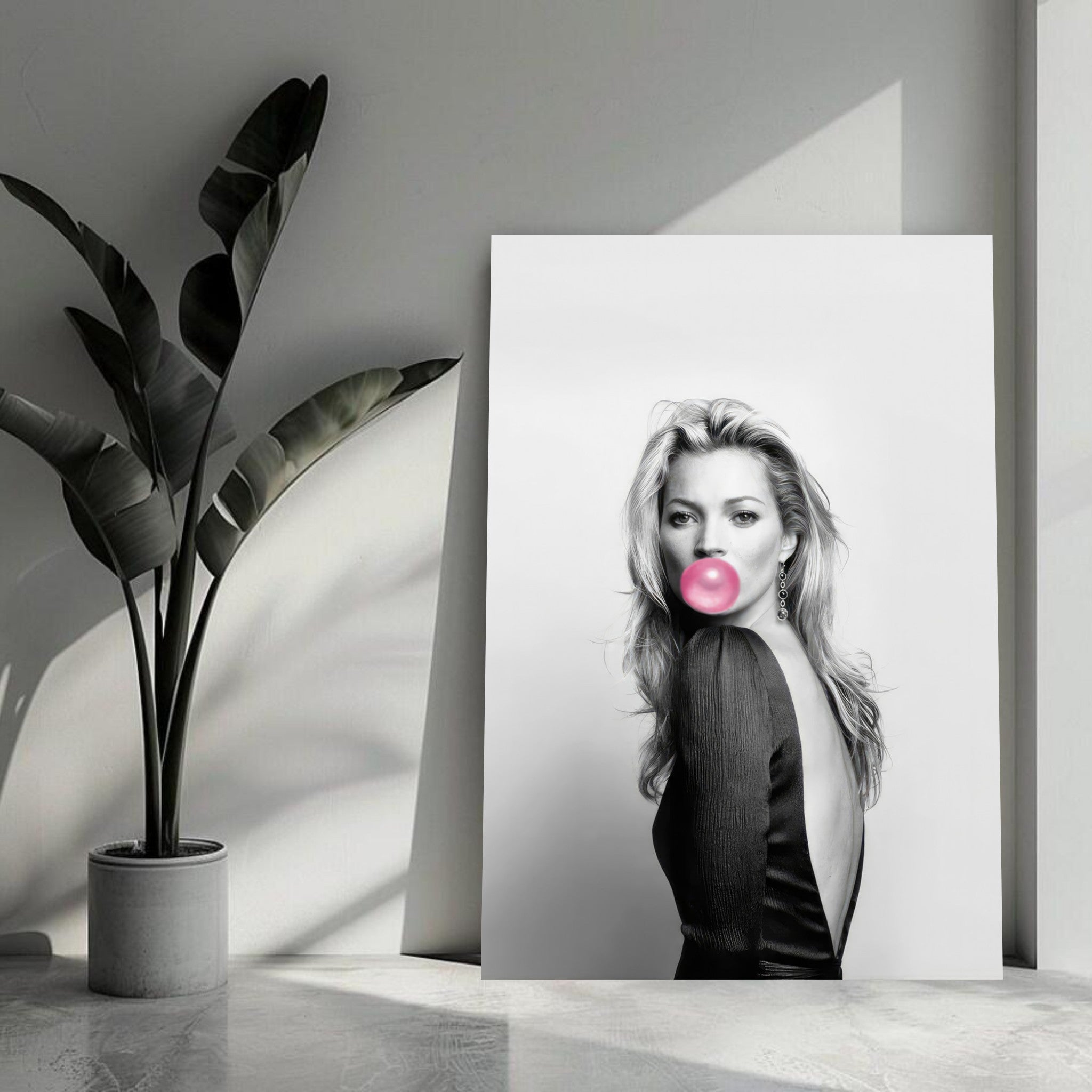 Kate Moss Bubble Gum Metal Print showcasing a black-and-white portrait with a pink bubble gum accent in a modern interior setting.