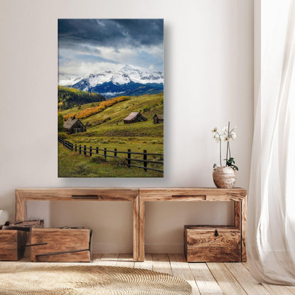 Telluride, Colorado canvas art featuring rustic cabins and snow-capped mountains against a vibrant autumn landscape.