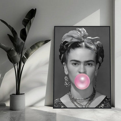 Frida Kahlo framed print with pink bubble gum in a modern minimalist room setting.