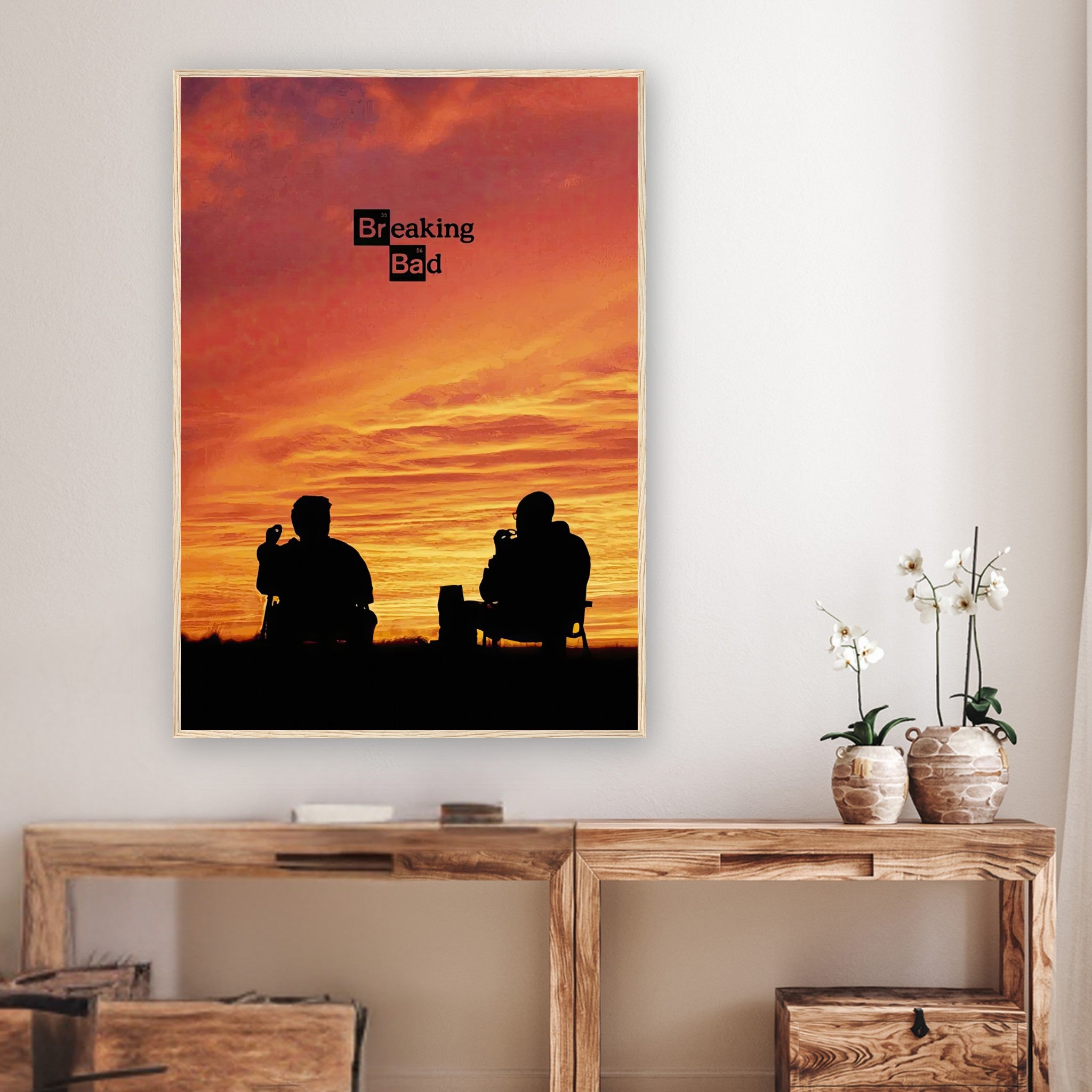 Framed Breaking Bad poster featuring Walter White and Jesse Pinkman silhouetted against a sunset in a modern interior.