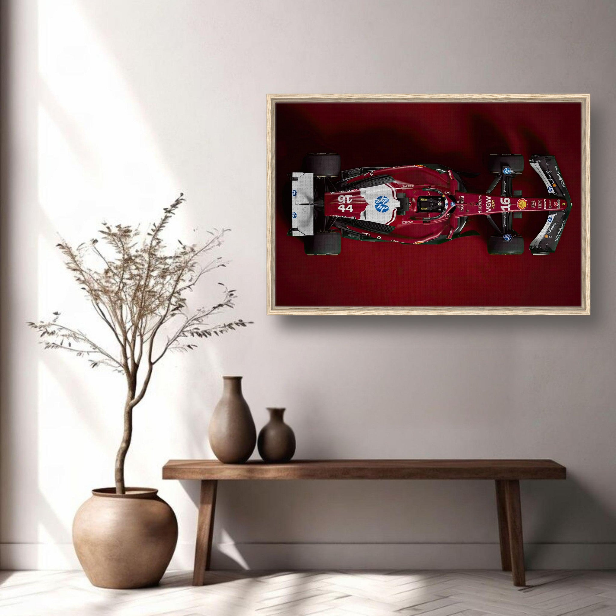 Framed canvas print of Ferrari F1 2025 car in a deep red background showcased in modern home decor.