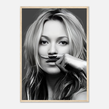 Black-and-white framed print of a woman playfully holding a mustache, adding humor and elegance to any space.