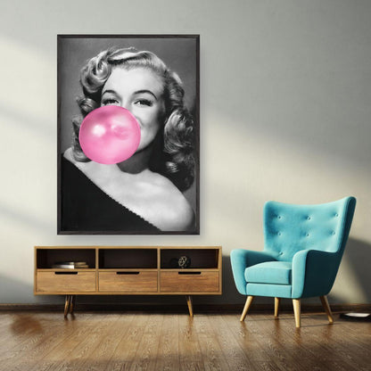 Vintage framed print of Marilyn Monroe blowing a pink bubble gum, adding personality to modern decor.