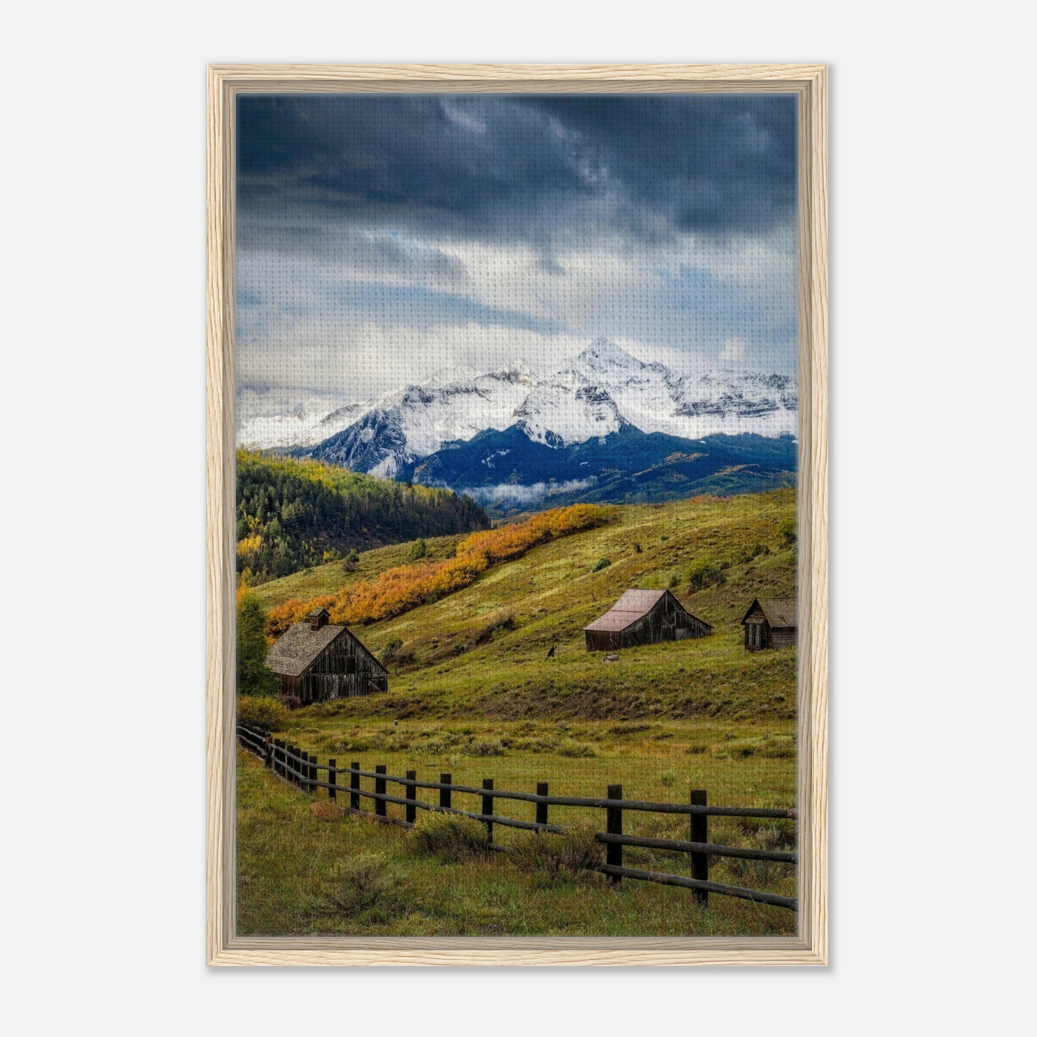 Framed canvas print of Telluride, Colorado showcasing snow-capped mountains and rustic barns in a serene valley.