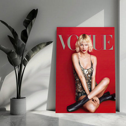 Taylor Swift Vogue poster featuring her stylish look and vibrant red background, perfect for fans and fashion enthusiasts.