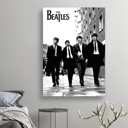 The Beatles cover poster featuring the iconic band walking in a black and white urban setting.