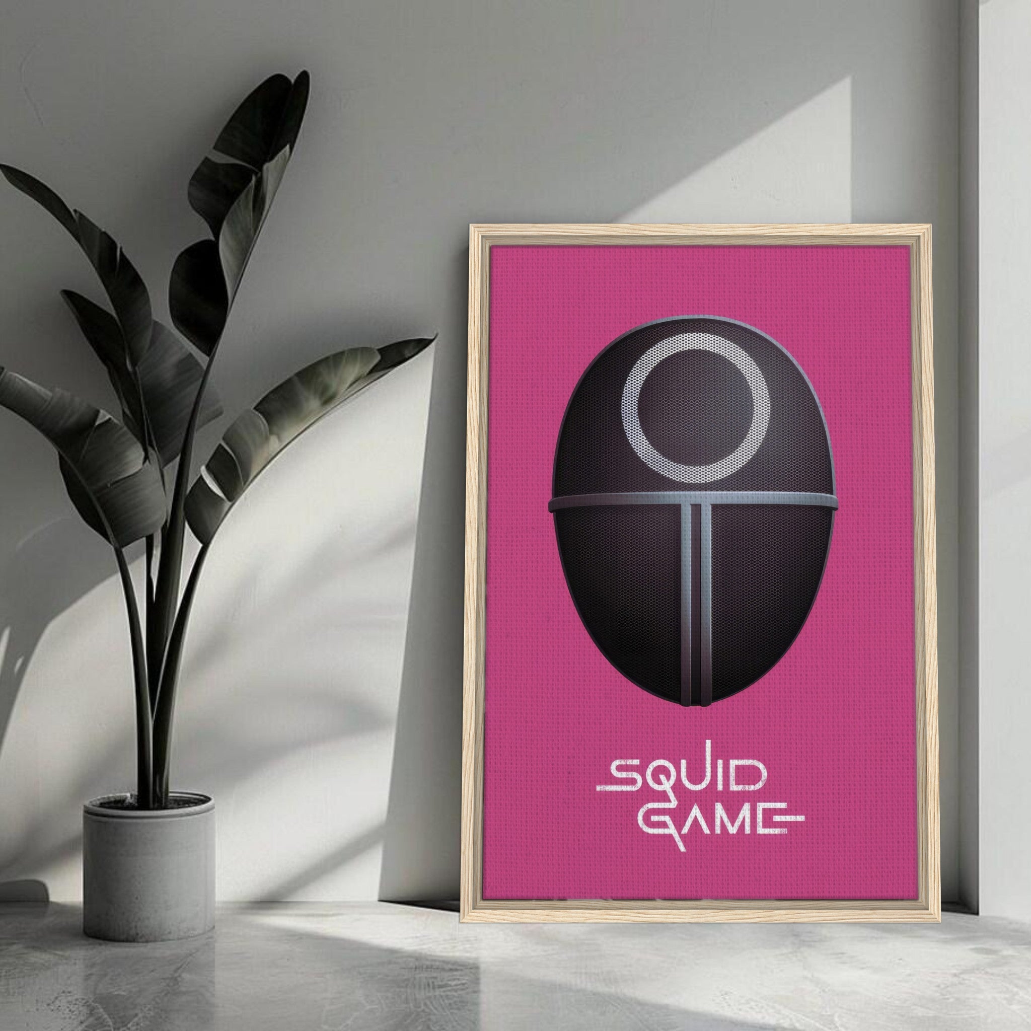 Squid Game Guard Mask framed canvas print on a pink background, enhancing modern decor for fans of the series.