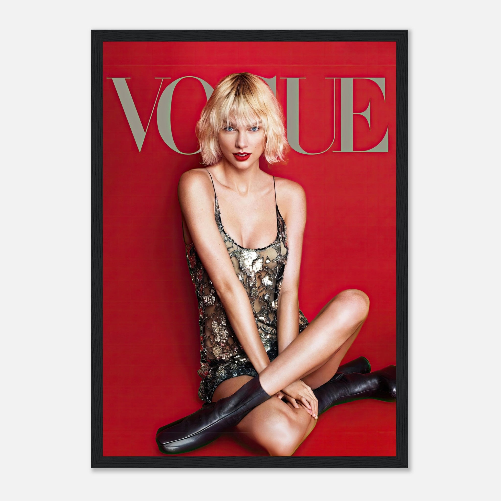 Taylor Swift Vogue Framed Poster showcasing elegance with a red backdrop and sequined dress, perfect for pop culture fans.