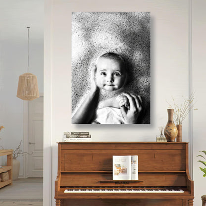 Black-and-white baby bath photo on metal print, showcasing a joyful moment in a nursery setting.
