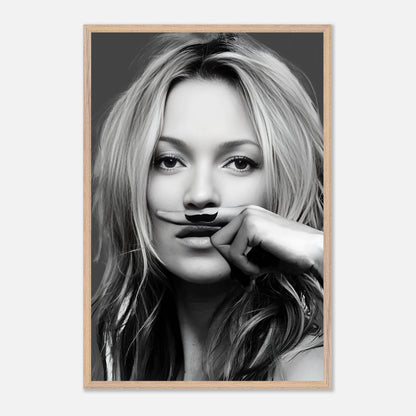 Vintage framed print of Kate Moss with a playful mustache in black and white for stylish wall decor.