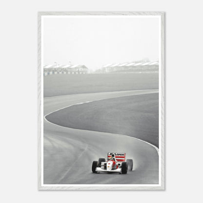 1988 Ayrton Senna McLaren MP4/4 vintage framed art capturing Formula 1 racing motion on track.