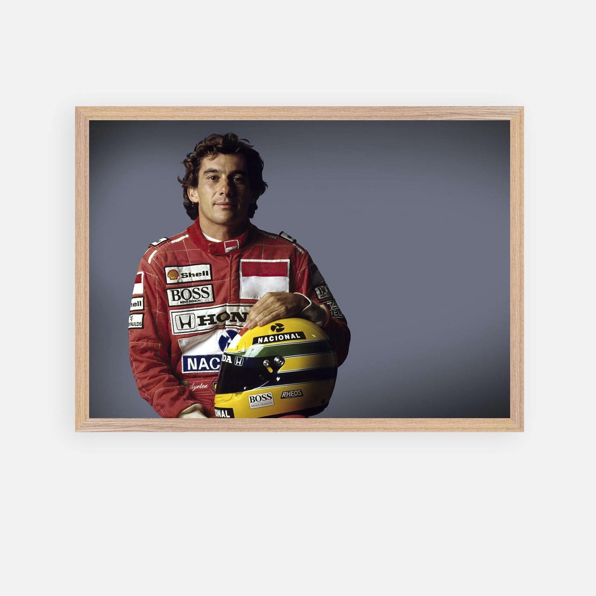 Ayrton Senna in racing suit holding helmet, framed fine art print celebrating his motorsport legacy.