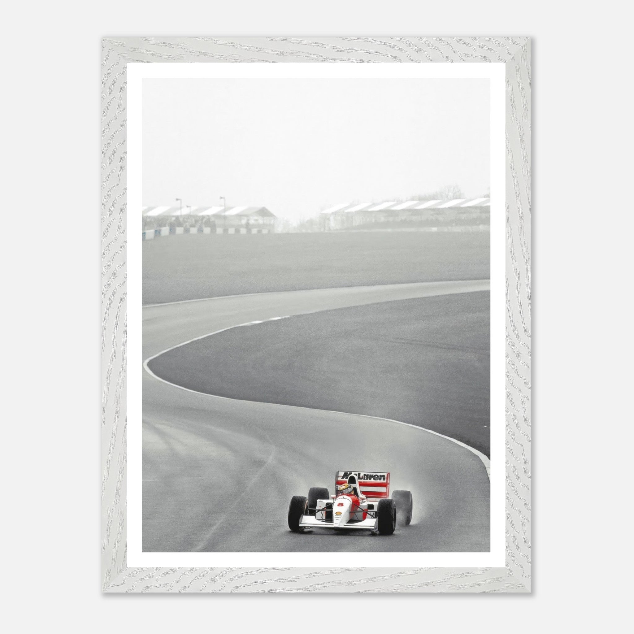 1988 Ayrton Senna McLaren MP4/4 vintage framed art capturing Formula 1 racing action on the track.