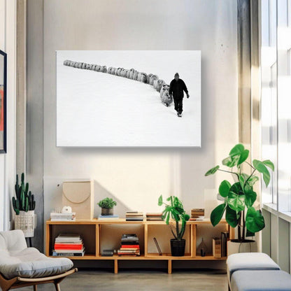 Black-and-white canvas print of shepherd walking with flock in a snowy landscape, enhancing rural decor.