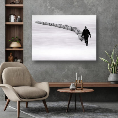 Brushed metal artwork of a shepherd leading sheep through a snow-covered landscape in black-and-white.