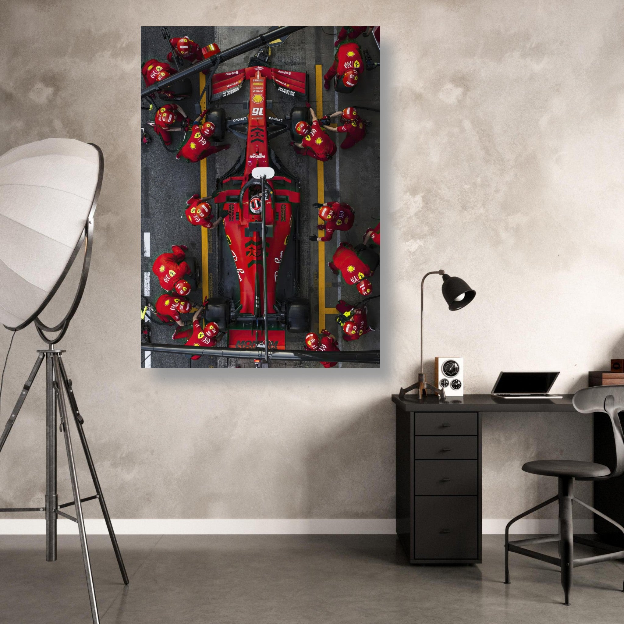 A vibrant metal print of a Ferrari pitstop, showcasing dynamic racing energy and a detailed high-gloss finish in a modern setting.