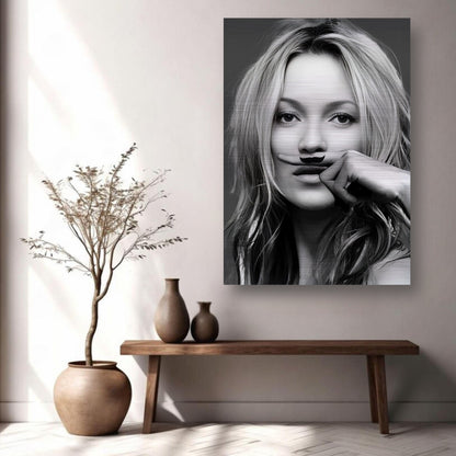 Kate Moss Mustache artwork in brushed metal displayed in a stylish living room with decor elements.