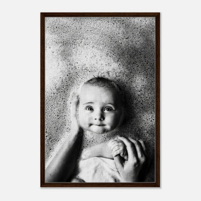 Baby in a bubble bath being held, captured in heartwarming black-and-white photography, framed canvas print.