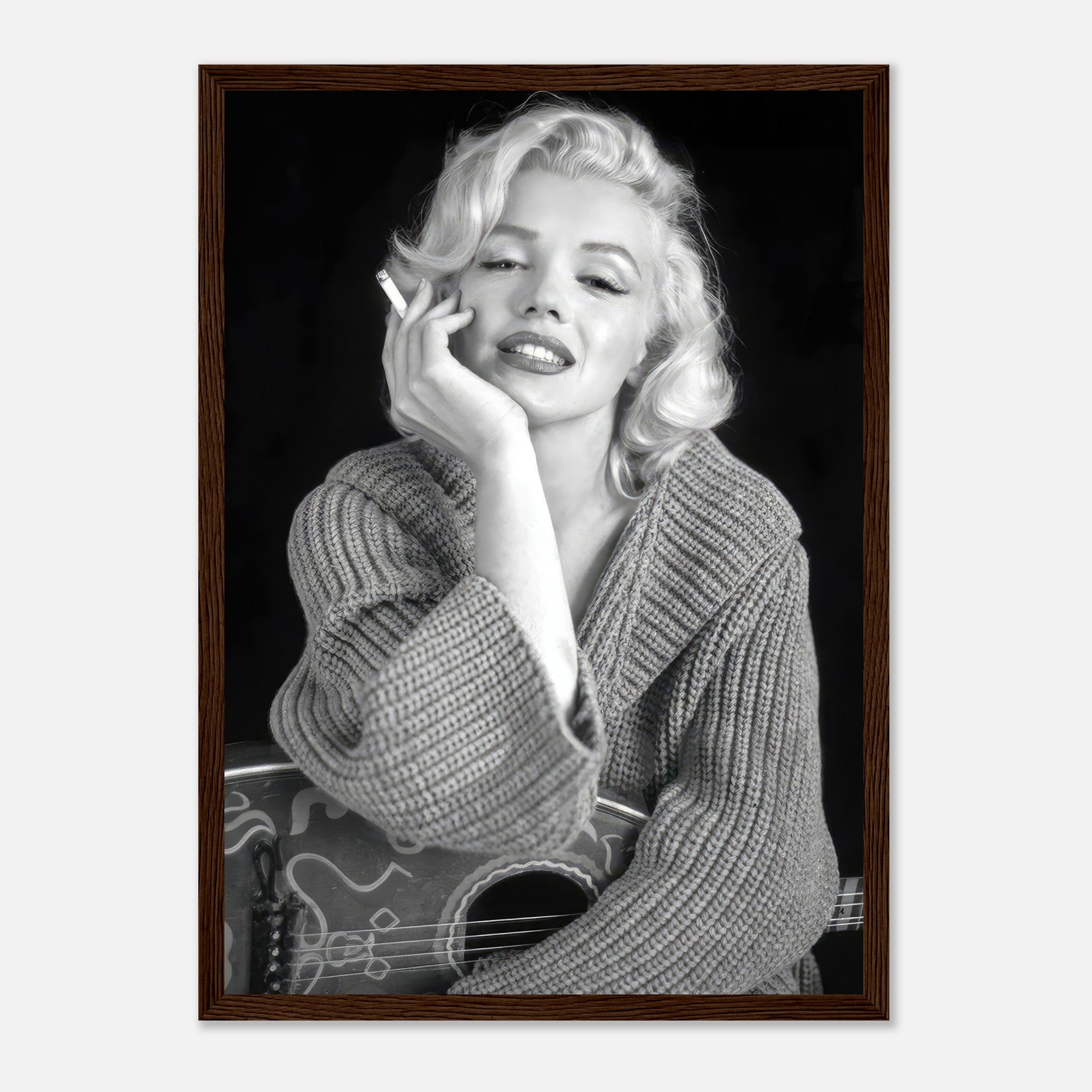 Marilyn Monroe smoking in a cozy sweater, framed black-and-white poster exuding timeless elegance and allure.