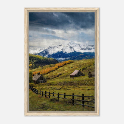 Framed canvas print of Telluride, Colorado, showcasing snow-capped mountains and rustic barns in a serene valley landscape.