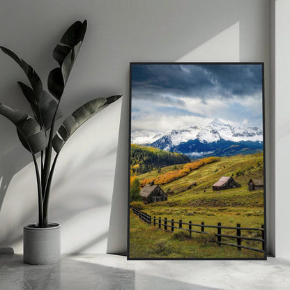 Stunning framed print of Telluride, Colorado with rolling meadows, rustic barns, and majestic snow-capped mountains.