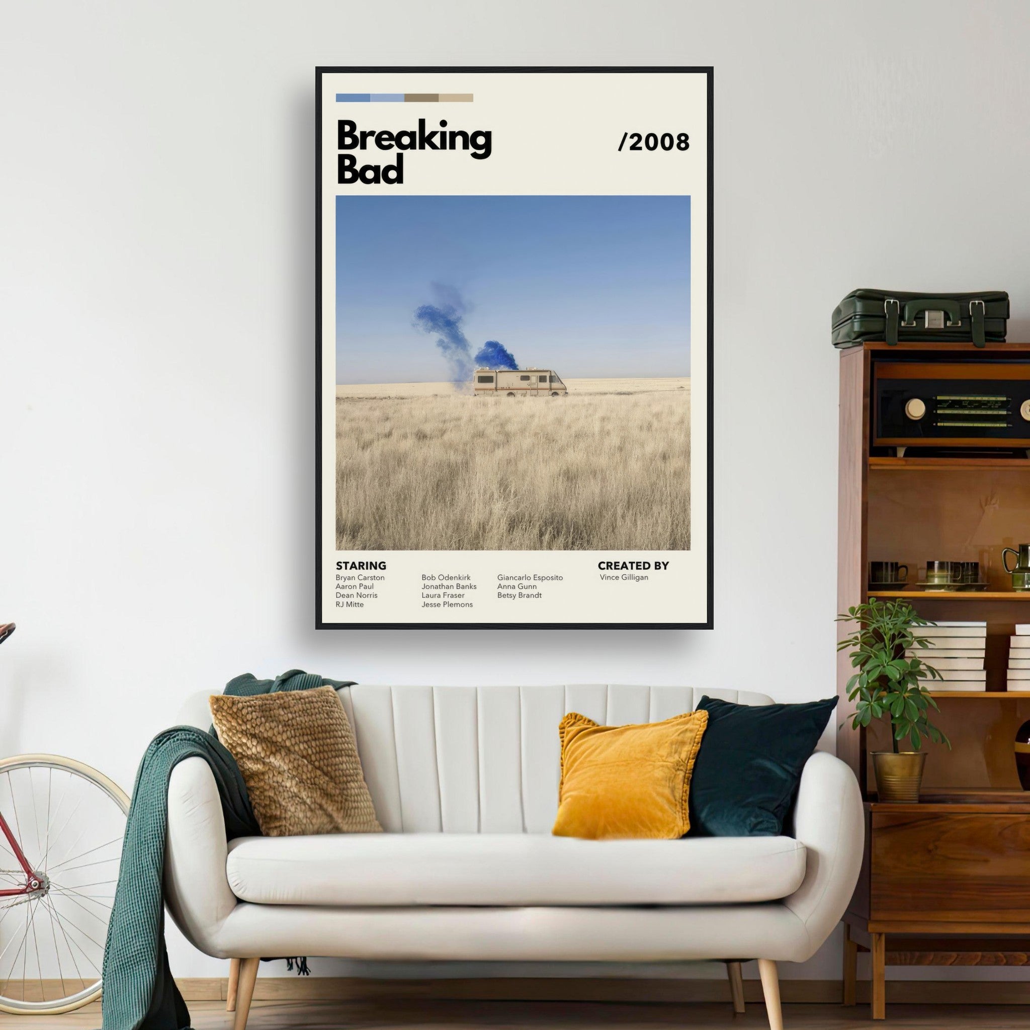 Framed print of Breaking Bad vintage RV scene in a desert, featuring blue smoke and minimalist design, displayed in a stylish living room.