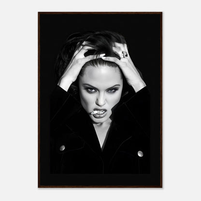 Bold black-and-white framed print of Angelina Jolie expressing fierce glamour and rebellion.