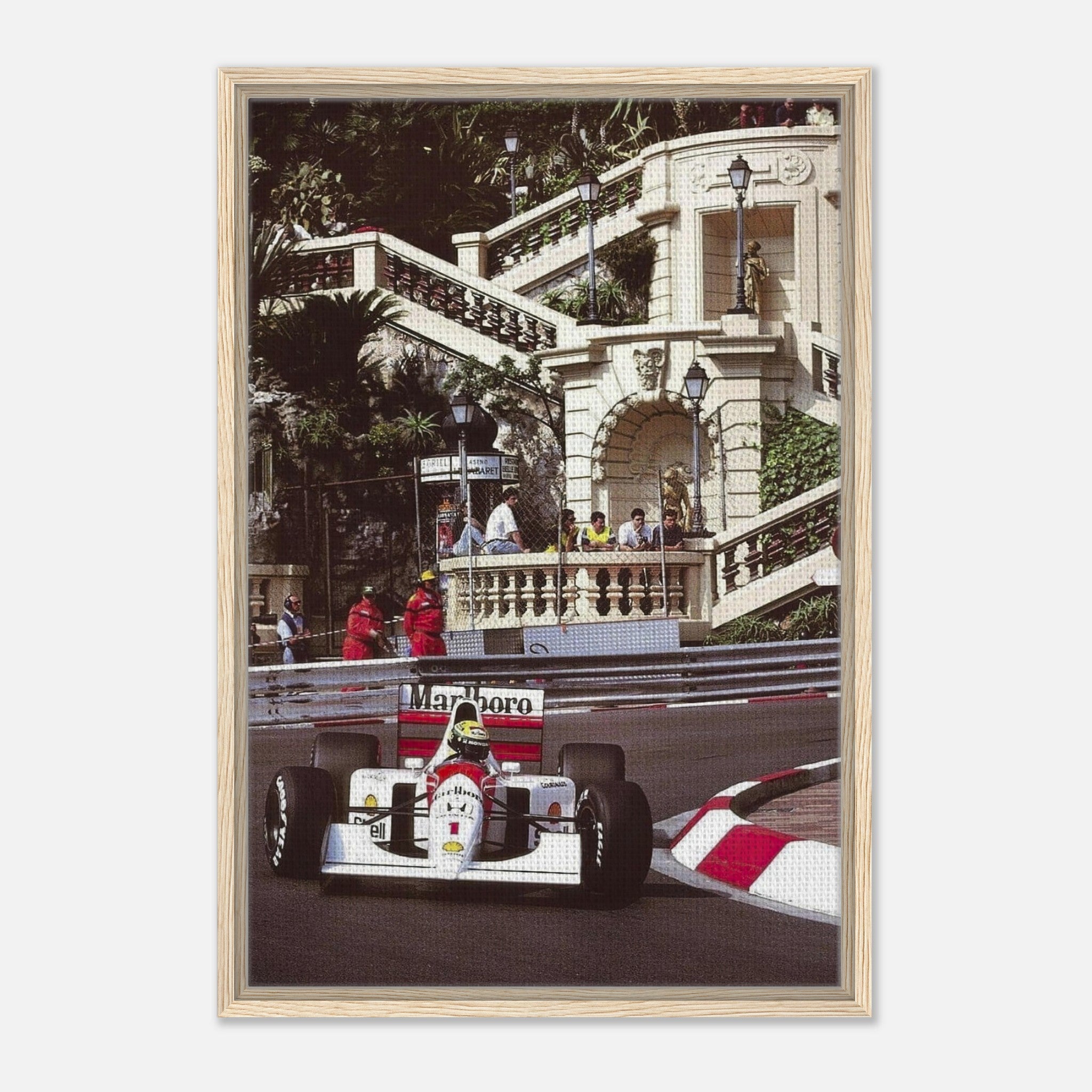 Framed canvas print of Ayrton Senna racing at Monaco, showcasing vibrant colors and dynamic motorsport action.