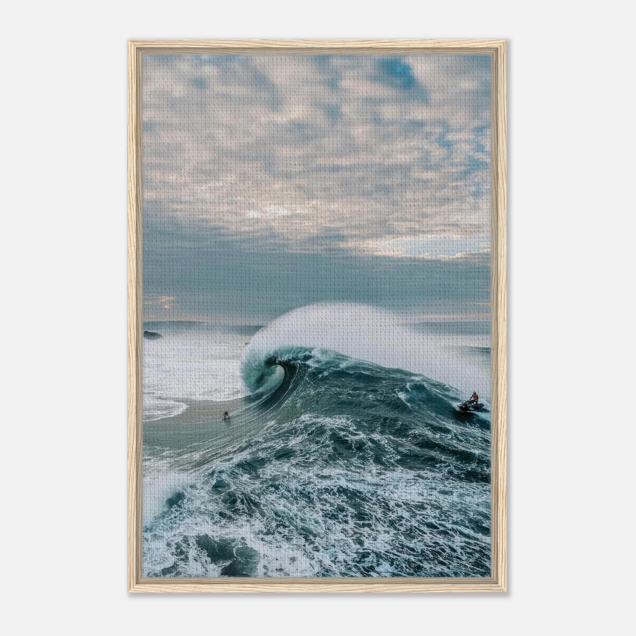 Big wave surfing framed canvas print showcasing a surfer riding a massive wave against a dramatic sky.