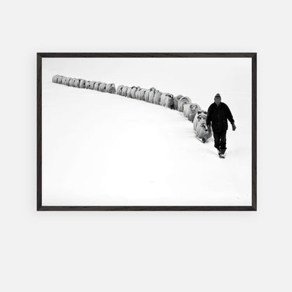 A shepherd guiding his flock through a snowy landscape in The Shepherd’s Trail Vintage Framed Art.