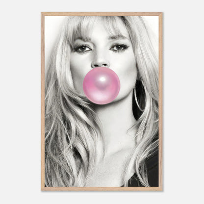 Kate Moss vintage framed print with pink bubble gum in mouth, black-and-white portrait, modern aesthetic decor.