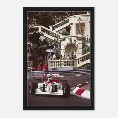 Framed canvas print of Ayrton Senna racing in Monaco, showcasing vibrant colors and dynamic motorsport action.