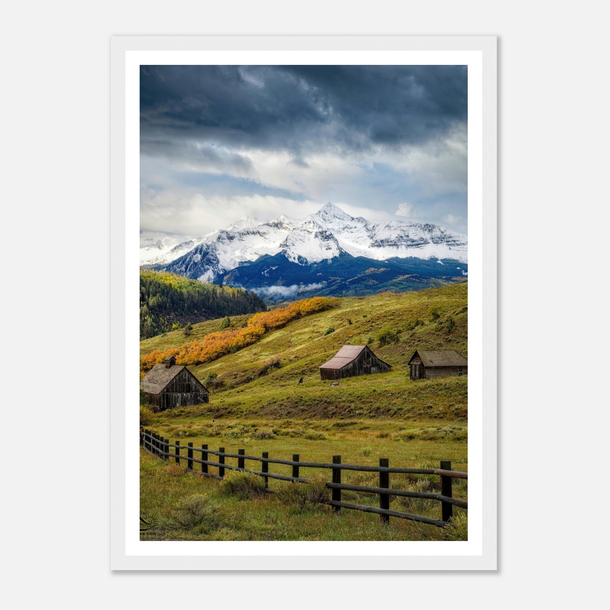 Framed print of Telluride, Colorado showcasing rustic barns against majestic snow-capped peaks and vibrant meadows.