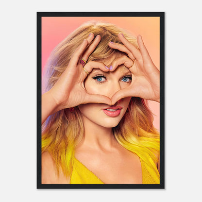 Taylor Swift framed print showcasing her playful heart gesture, vibrant colors, and captivating charm. Perfect for fans.