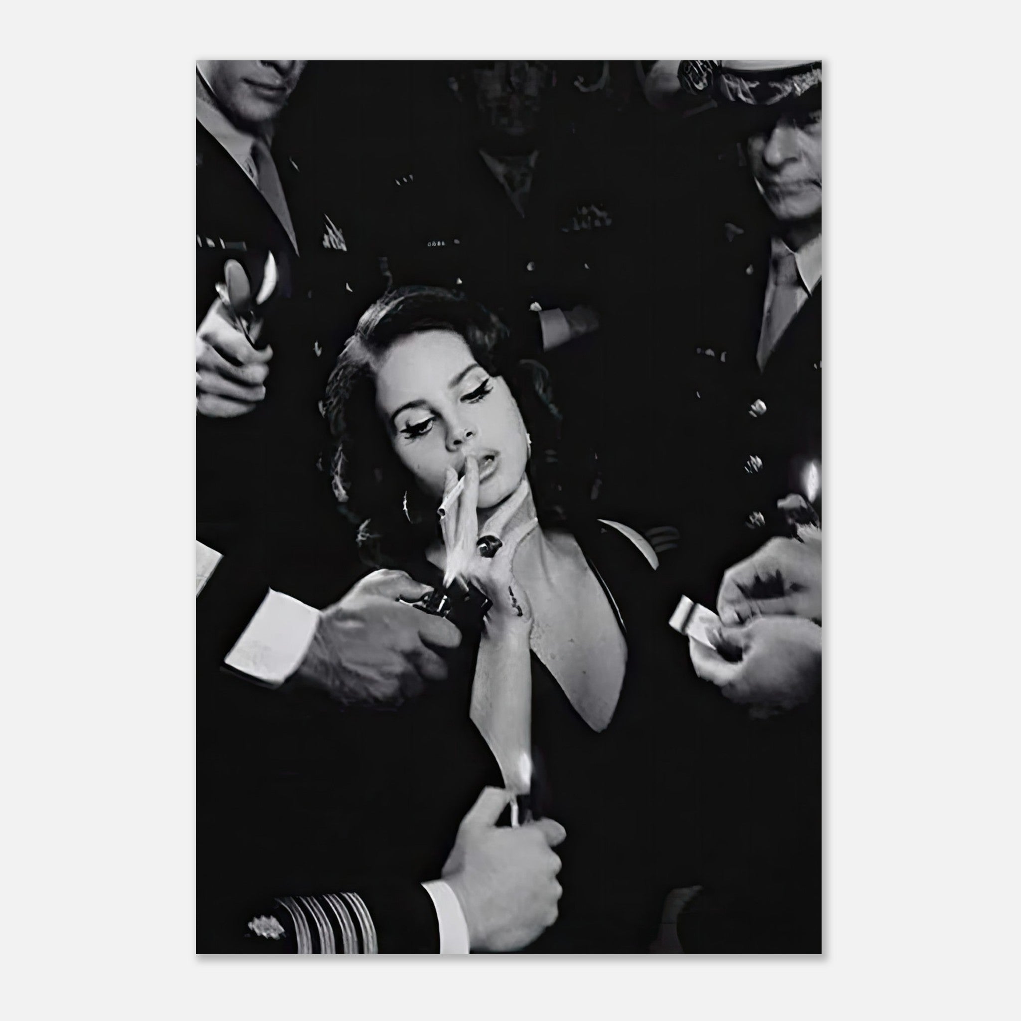 Lana Del Rey in black-and-white, smoking, surrounded by admirers in military attire, capturing cinematic allure.